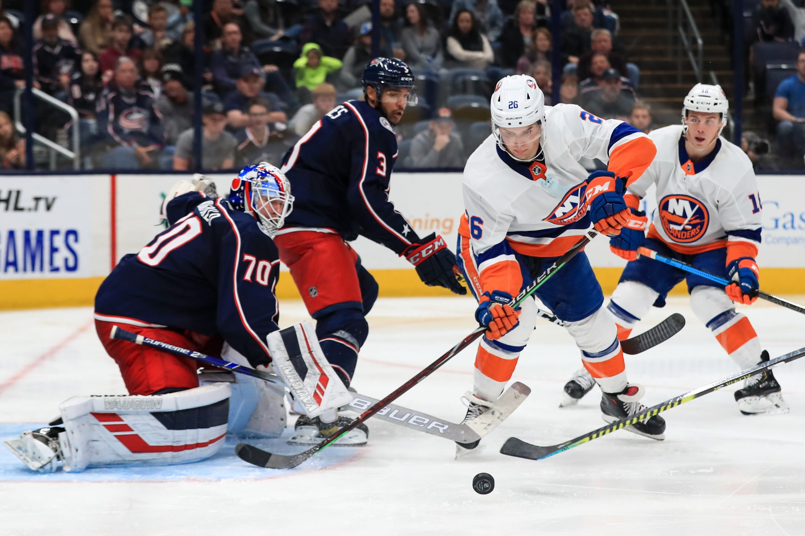 Oct 19, 2019; Columbus, OH, USA; Columbus Blue Jackets goaltender Joonas Korpisalo (70) attempts a save against New York Islanders right wing Oliver Wahlstrom (26) in the third period at Nationwide Arena. Mandatory Credit: Aaron Doster-USA TODAY Sports