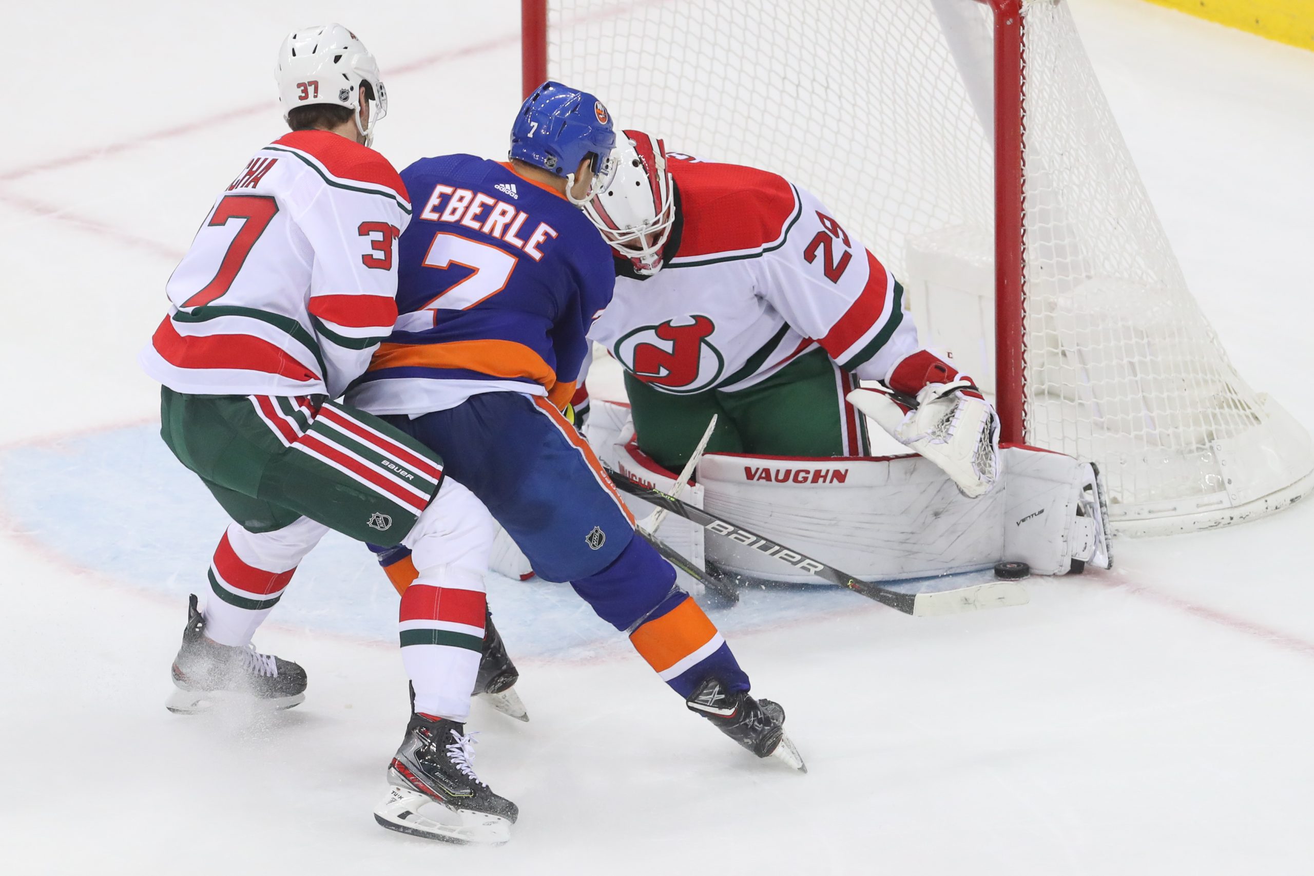 Jan 7, 2020; Newark, New Jersey, USA; New Jersey Devils goaltender Mackenzie Blackwood (29) makes a save on New York Islanders right wing Jordan Eberle (7) during overtime at Prudential Center. Mandatory Credit: Ed Mulholland-USA TODAY Sports
