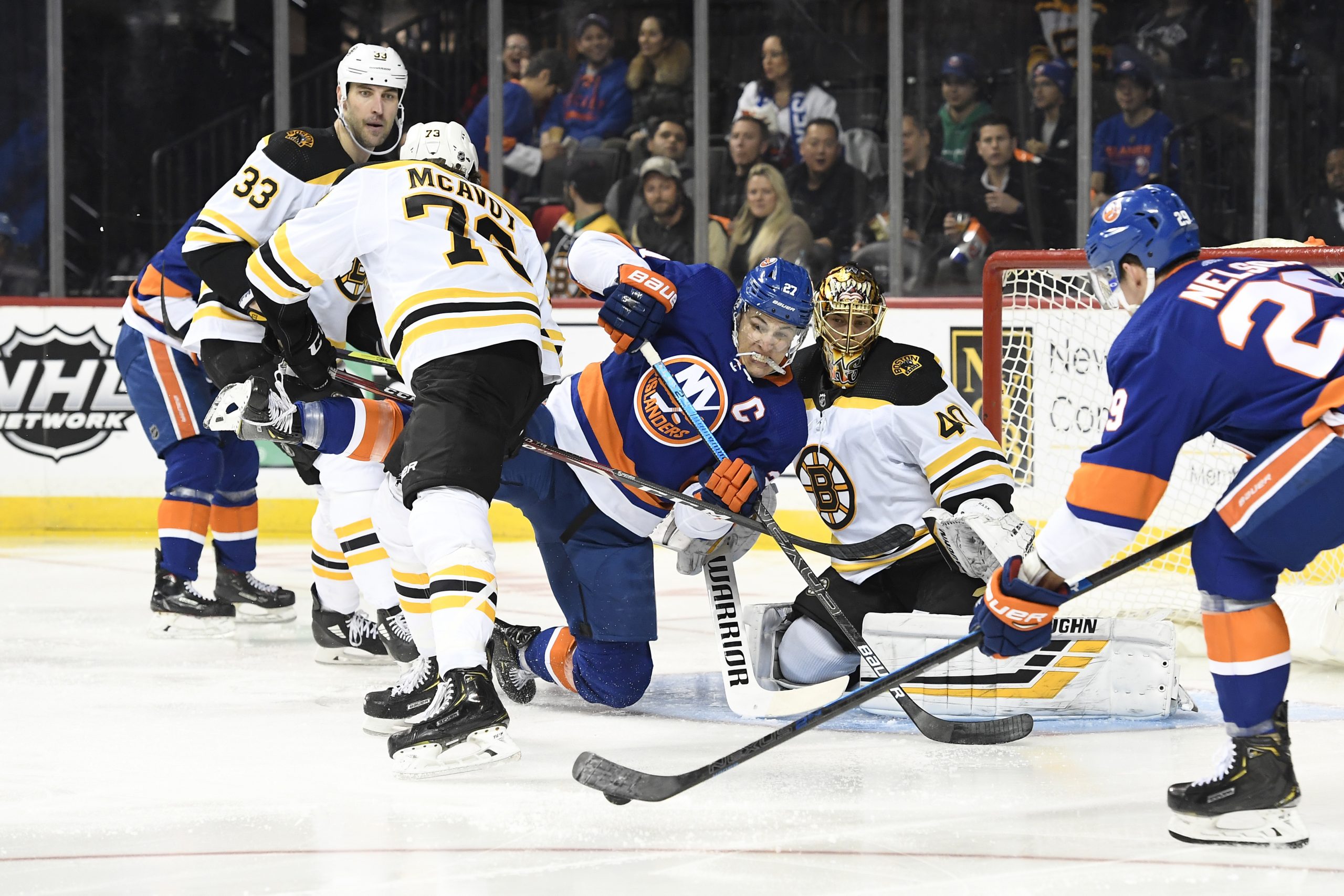 Jan 11, 2020; Brooklyn, New York, USA; New York Islanders center Brock Nelson (29) and left wing Anders Lee (27) attempt a shot on goal against Boston Bruins goaltender Tuukka Rask (40) during the second period at Barclays Center. Mandatory Credit: Sarah Stier-USA TODAY Sports
