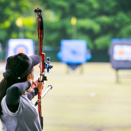 woman archer shooting with his bow