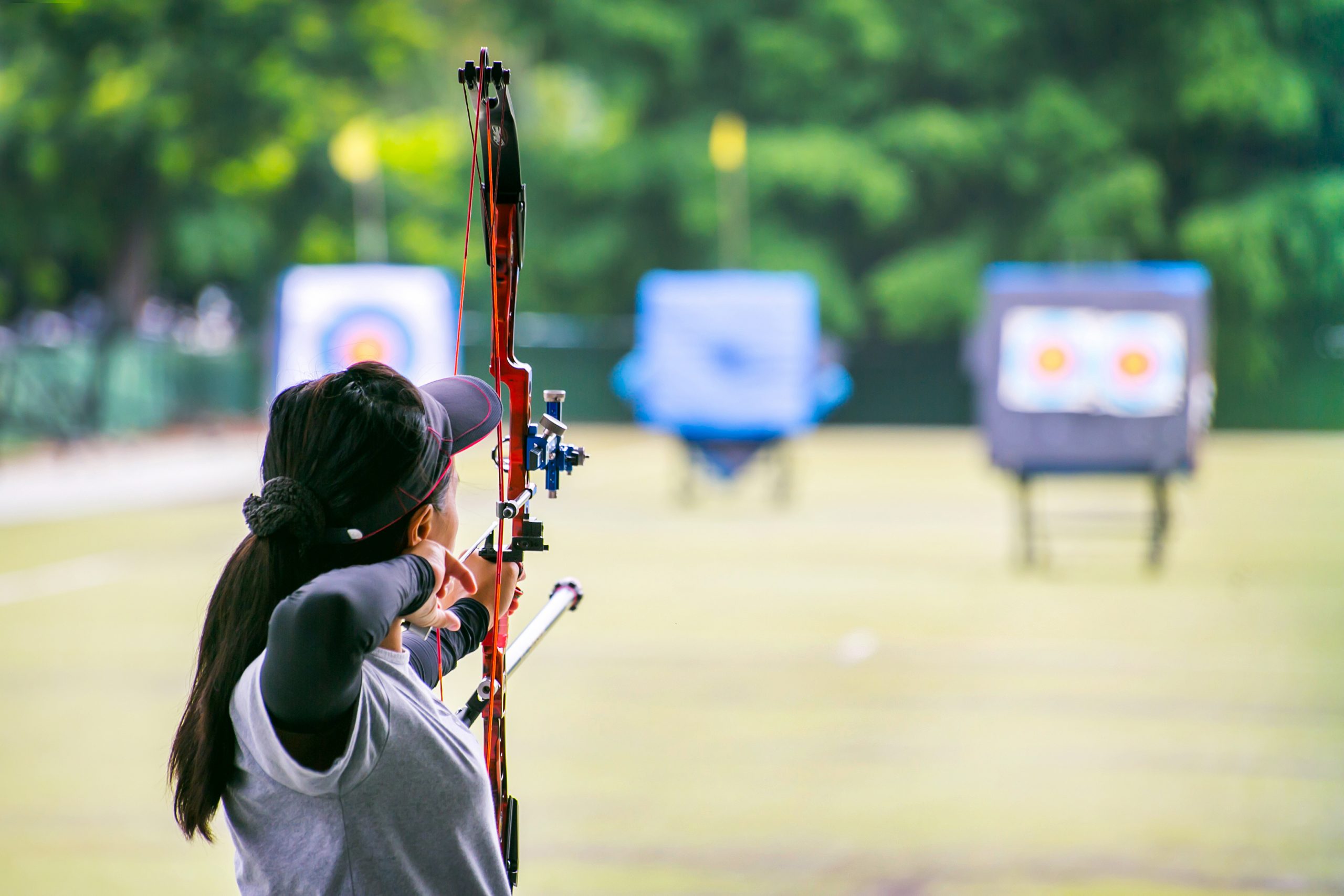 woman archer shooting with his bow