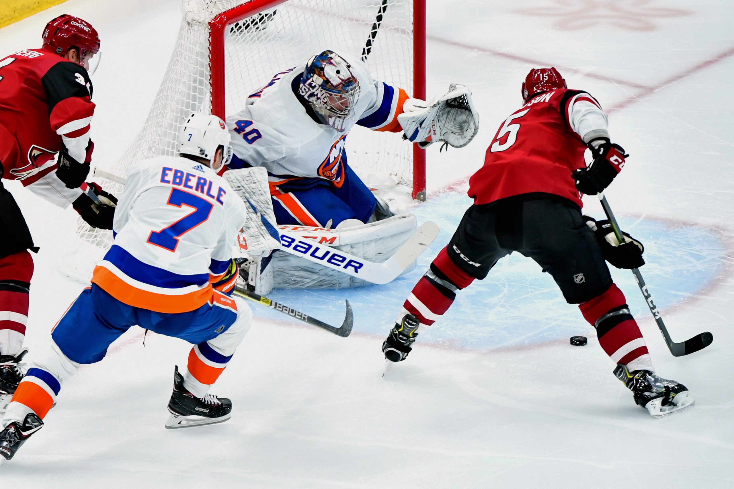 Feb 17, 2020; Glendale, Arizona, USA; Arizona Coyotes center Brad Richardson (15) shoots against New York Islanders goaltender Semyon Varlamov (40) during the second period at Gila River Arena. Mandatory Credit: Matt Kartozian-USA TODAY Sports