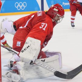 Feb 16, 2018; Gangneung, South Korea; Olympic Athlete of Russia defenseman Vladislav Gavrikov (4) and Slovenia forward Miha Verlic (91) battle for the puck in front of Olympic Athlete of Russia goalkeeper Ilya Sorokin (31) during the third period at the Pyeongchang 2018 Olympic Winter Games at Gangneung Hockey Centre. Mandatory Credit: David E. Klutho-USA TODAY Sports
