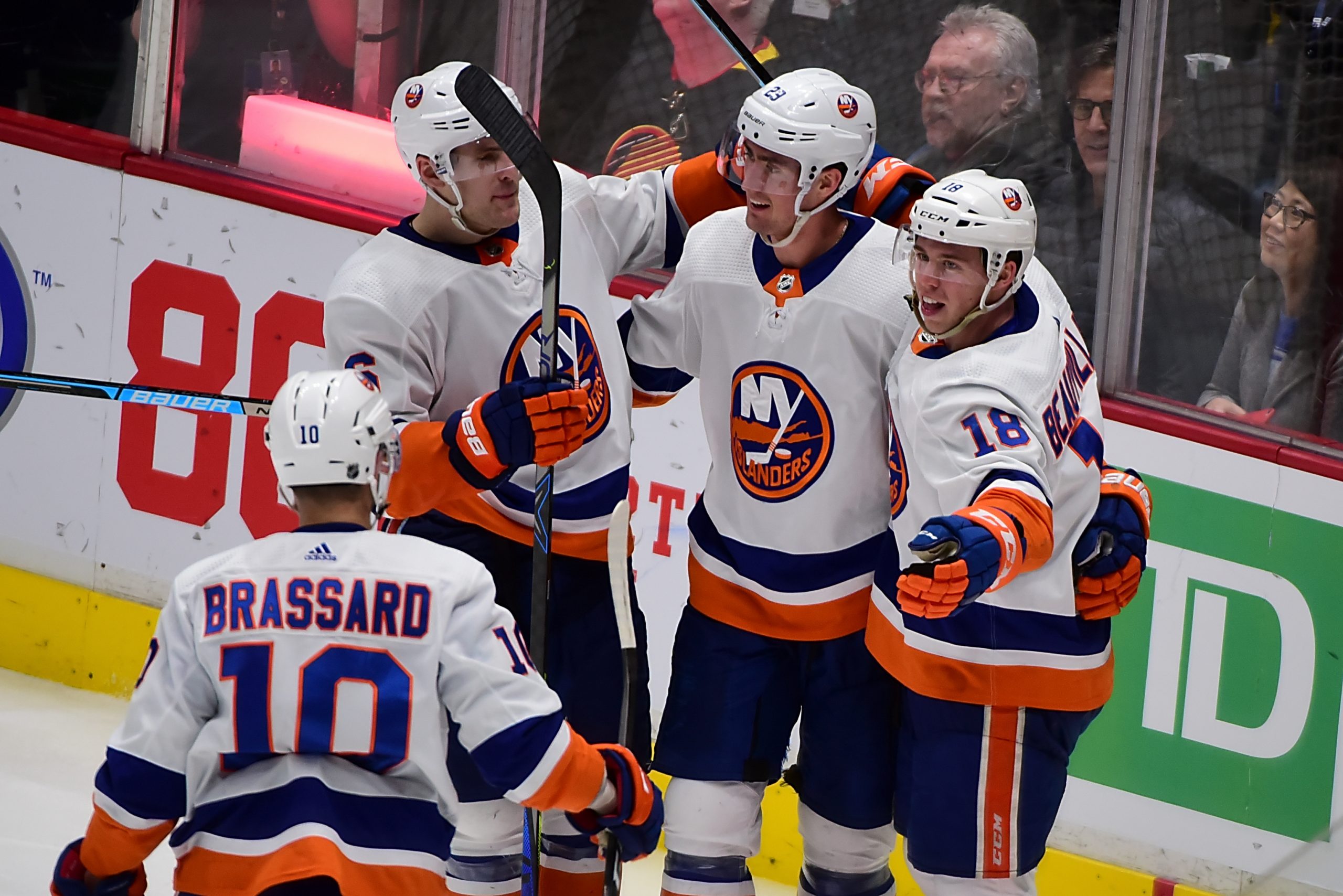Mar 10, 2020; Vancouver, British Columbia, CAN; New York Islanders forward Anthony Beauvillier (18) celebrates with forward Brock Nelson (29) and forward Derick Brassard (10) after scoring against the Vancouver Canucks during the third period at Rogers Arena. Mandatory Credit: Anne-Marie Sorvin-USA TODAY Sports