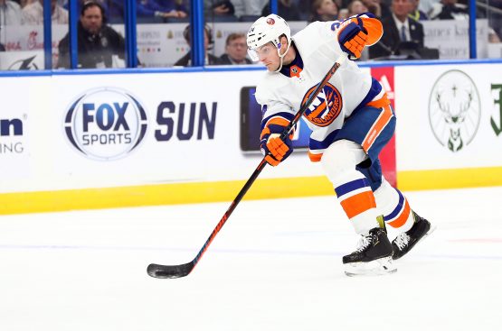 Dec 9, 2019; Tampa, FL, USA;New York Islanders defenseman Scott Mayfield (24) shoots against the Tampa Bay Lightning during the second period at Amalie Arena. Mandatory Credit: Kim Klement-USA TODAY Sports