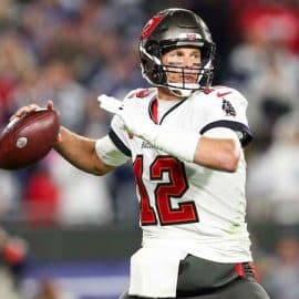 Tom Brady throwing a pass in the NFC Wild Card game.