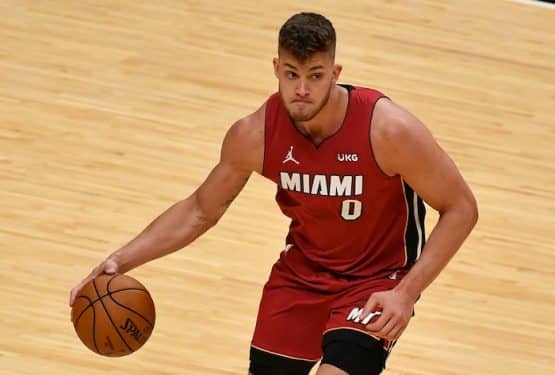 Miami Heat center Meyers Leonard dribbling the ball.