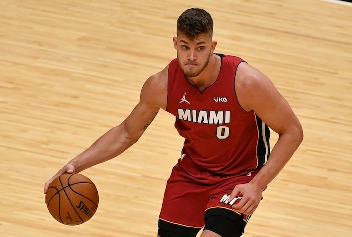Miami Heat center Meyers Leonard dribbling the ball.