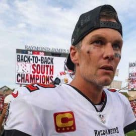 Tom Brady stares and walks off the field.