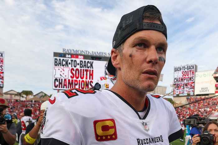 Tom Brady stares and walks off the field.
