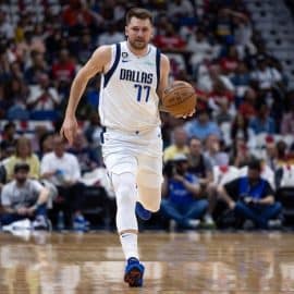 Dallas Mavericks guard Luka Doncic dribbles the ball.