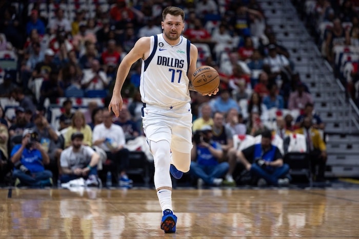 Dallas Mavericks guard Luka Doncic dribbles the ball.