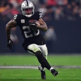 Las Vegas Raiders running back Josh Jacobs runs the ball.