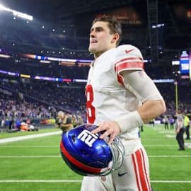 New York Giants quarterback Daniel Jones runs off field.