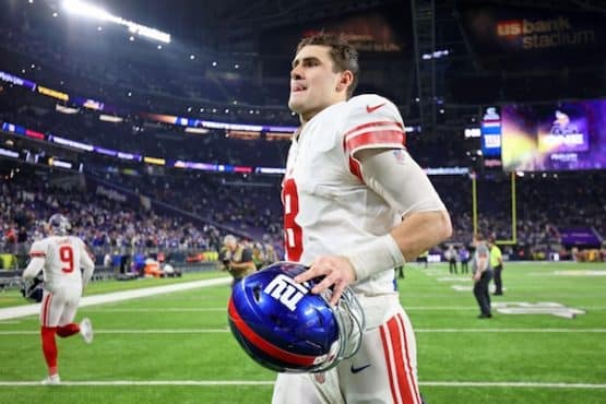 New York Giants quarterback Daniel Jones runs off field.