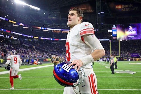 New York Giants quarterback Daniel Jones runs off field.