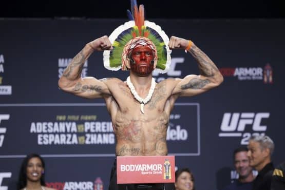 Alex Pereira gestures during weigh-ins for UFC 281.