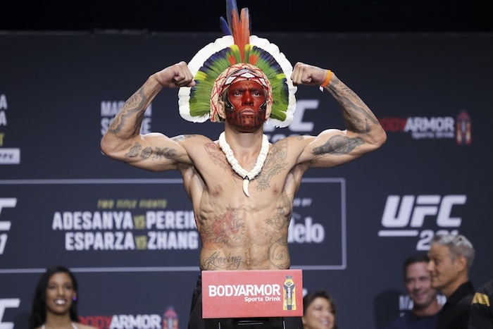 Alex Pereira gestures during weigh-ins for UFC 281.