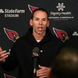 Arizona Cardinals head coach Jonathan Gannon speaks at the podium.