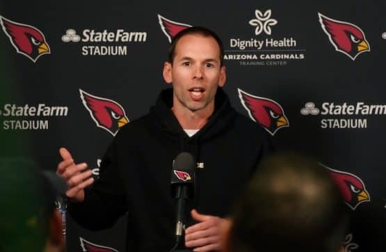 Arizona Cardinals head coach Jonathan Gannon speaks at the podium.