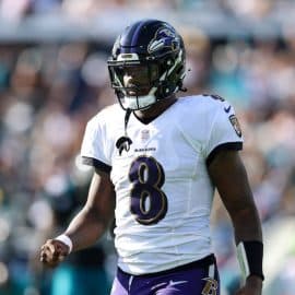 Baltimore Ravens quarterback Lamar Jackson walks off the field.