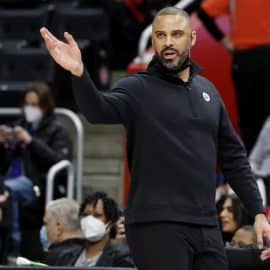 Boston Celtics head coach Ime Udoka holds his hand up.