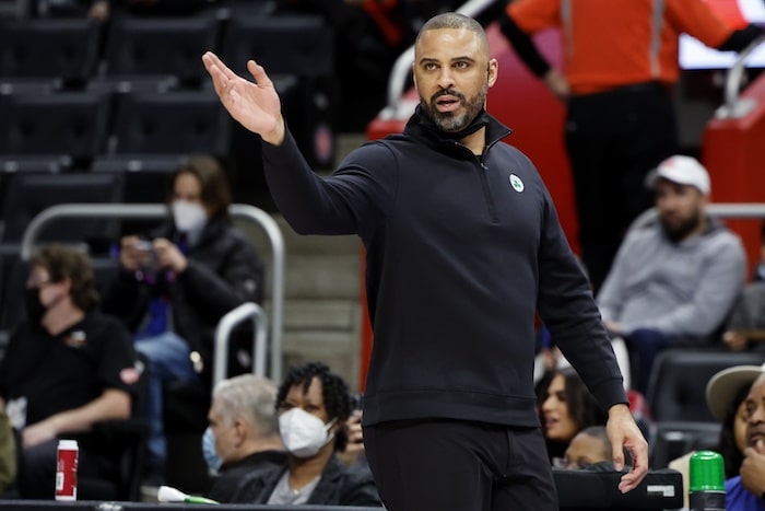 Boston Celtics head coach Ime Udoka holds his hand up.