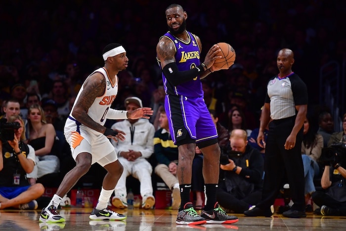 Los Angeles Lakers forward LeBron James holds the ball.