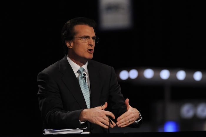 Mel Kiper at a desk.