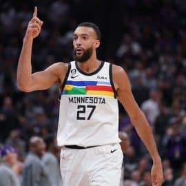 Minnesota Timberwolves center Rudy Gobert puts his finger up.