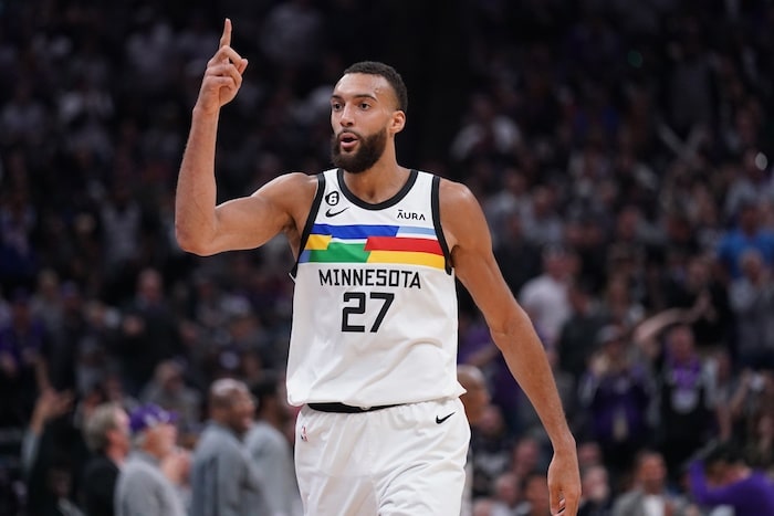 Minnesota Timberwolves center Rudy Gobert puts his finger up.