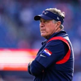 New England Patriots head coach Bill Belichick stands and stares.
