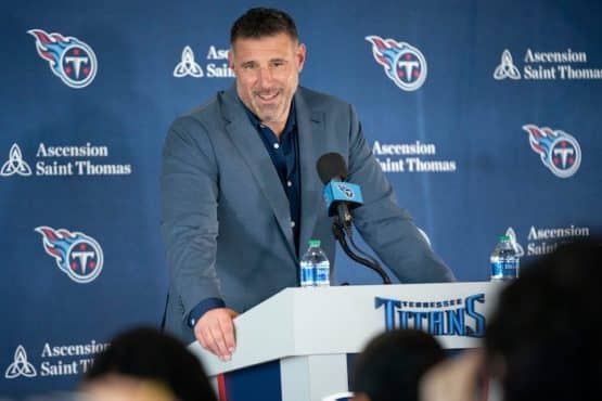 Tennessee Titans head coach Mike Vrabel at a podium.