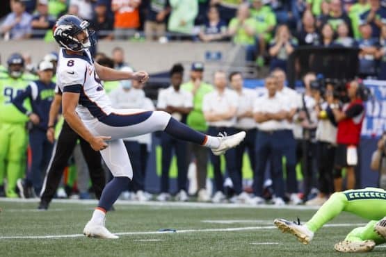 Denver Broncos place kicker Brandon McManus kicks the ball.