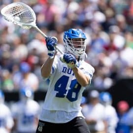 Duke goalie throws a pass.