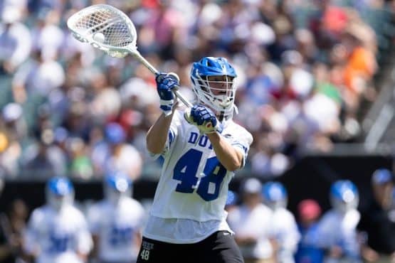 Duke goalie throws a pass.