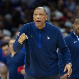 Philadelphia 76ers head coach Doc Rivers stands.