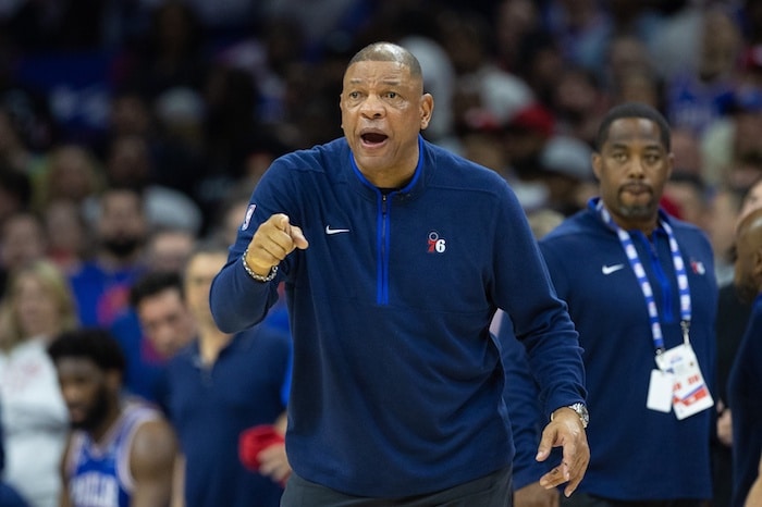 Philadelphia 76ers head coach Doc Rivers stands.