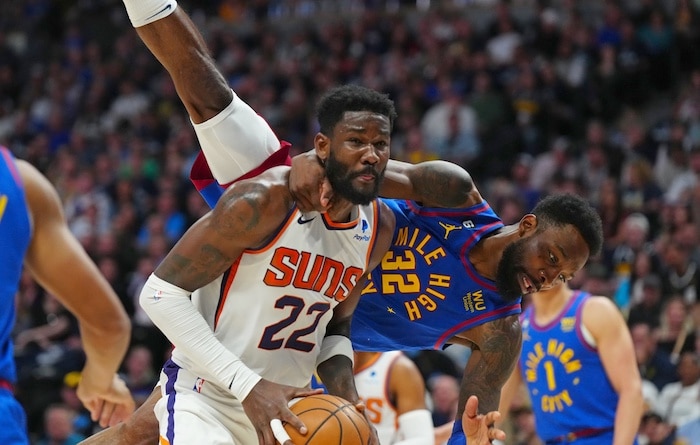 Phoenix Suns center Deandre Ayton stands up.