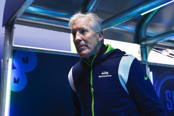 Seattle Seahawks head coach Pete Carroll walks in tunnel.