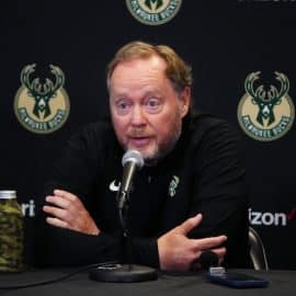 Bucks head coach Mike Budenholzer at the podium.