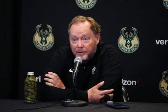 Bucks head coach Mike Budenholzer at the podium.
