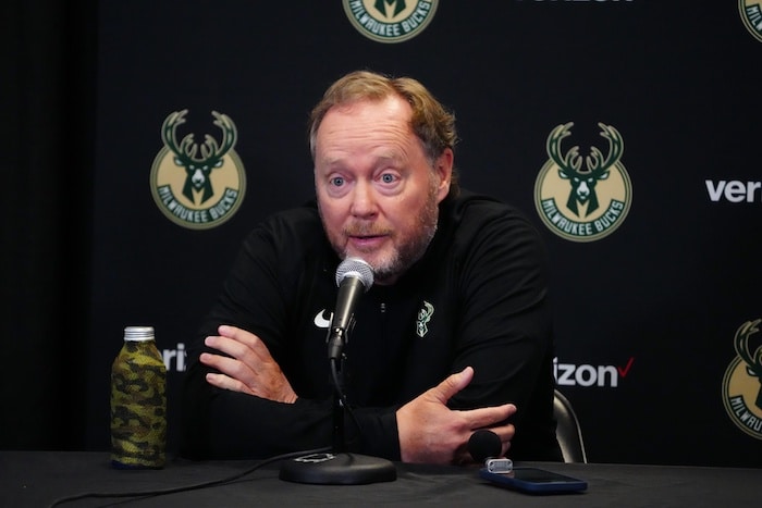 Bucks head coach Mike Budenholzer at the podium.