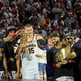 The Denver Nuggets celebrate after center Nikola Jokic