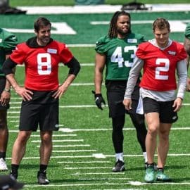 New York Jets quarterback Aaron Rodgers (8) and quarterback Zach Wilson