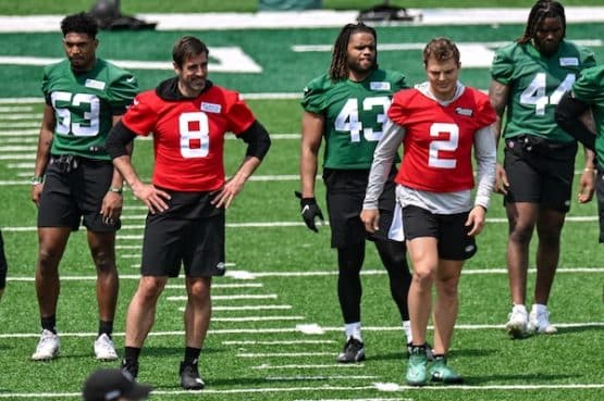 New York Jets quarterback Aaron Rodgers (8) and quarterback Zach Wilson
