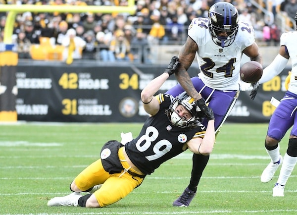 Pittsburgh Steelers wide receiver Gunner Olszewski (89) lands near Baltimore Ravens cornerback Marcus Peters