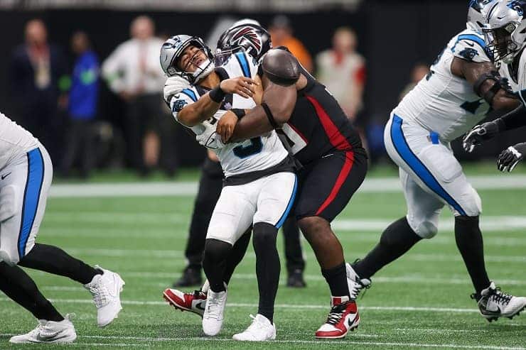 bryce young sacked by falcons DL in opener (1)