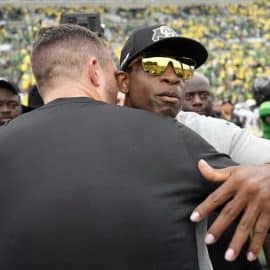 coach prime hugs oregon coach (1)