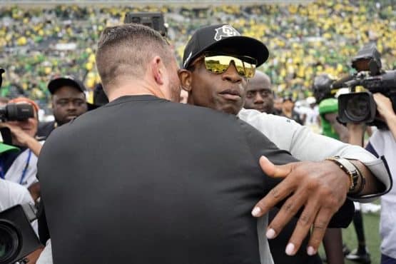 coach prime hugs oregon coach (1)